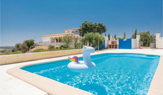 Beautiful home in Lora del Ro with 4 Bedrooms, WiFi and Swimming pool